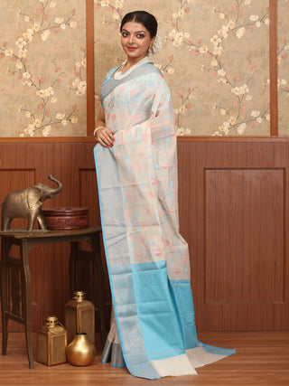 Off White Mercerised Cotton Banarasi With Sky Blue Border And Floral Jaal