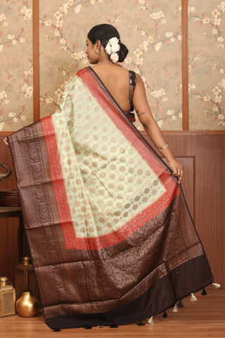 Cream Semi Georgette Banaras Saree With Brown And Red Traditional Border And Butis